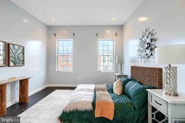 a bedroom with a bed and a couch