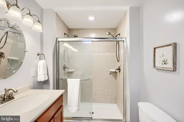 a bathroom with a shower and a sink
