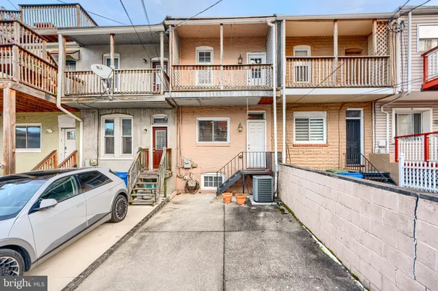 a view of a building with sitting area