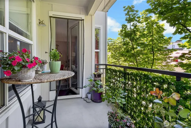 a table and chairs in front of a house