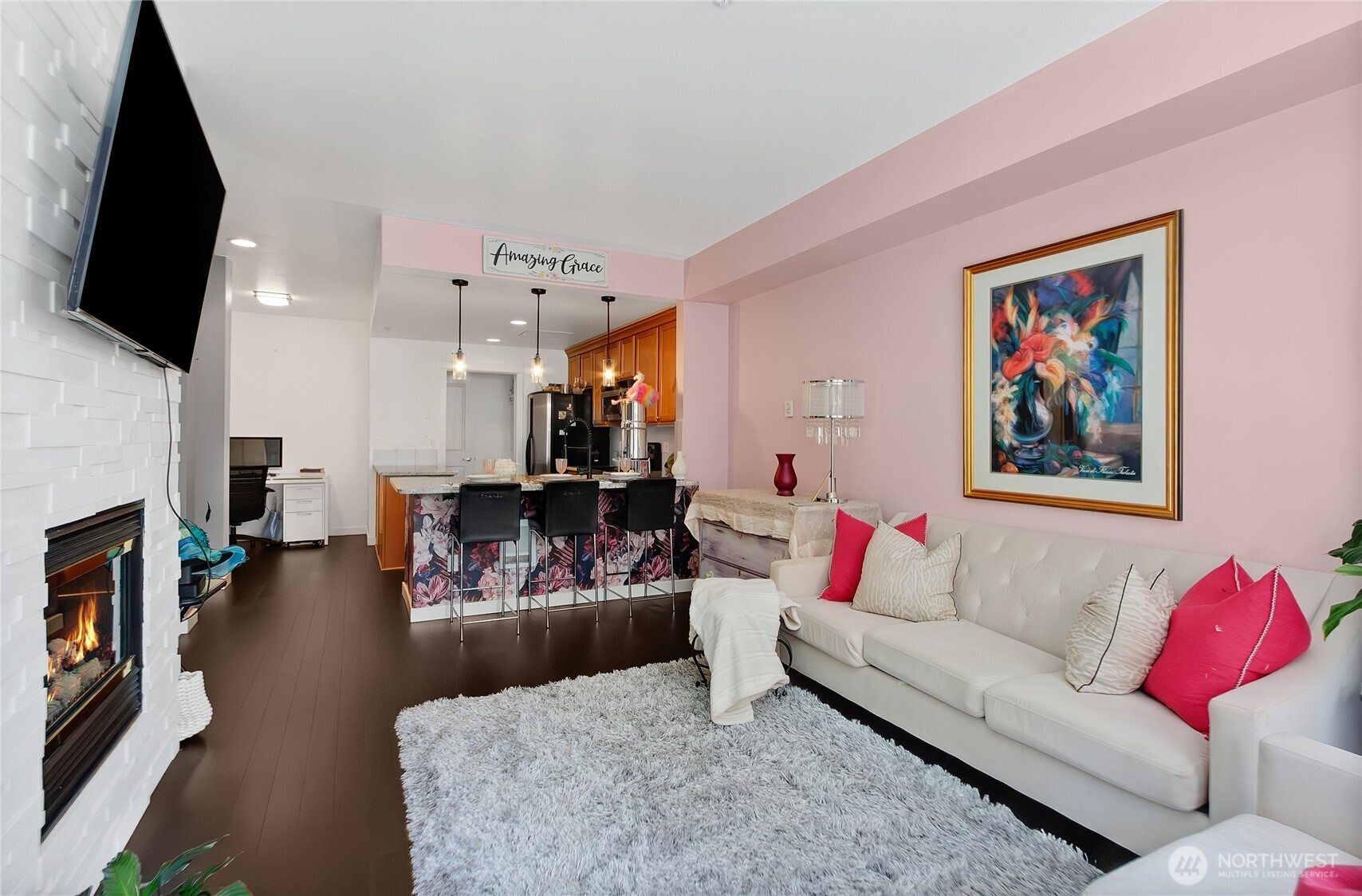 55 Williams Avenue South, Unit 209 Renton, WA 98057 - Photo 6 of 21 a living room with furniture fireplace and flat screen tv