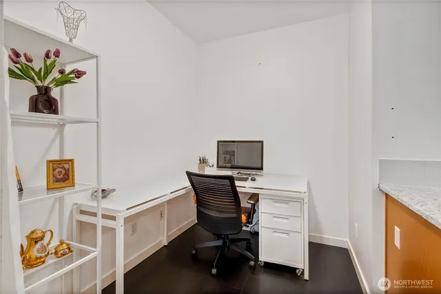 a workspace with furniture and wooden floor