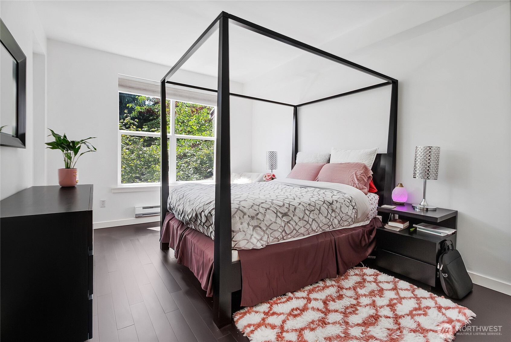 55 Williams Avenue South, Unit 209 Renton, WA 98057 - Photo 9 of 21 a bedroom with a bed window and table