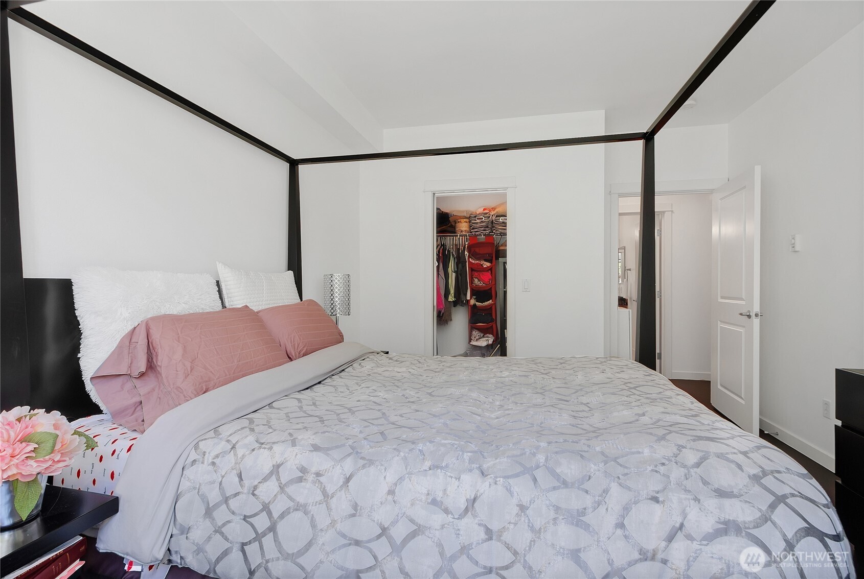 55 Williams Avenue South, Unit 209 Renton, WA 98057 - Photo 10 of 21 a bedroom with a bed and a mirror