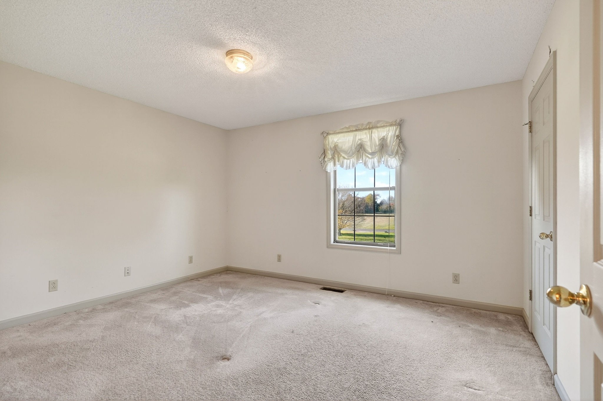 4143 Viola Road McMinnville, TN 37110 - Photo 13 of 27 a view of an empty room with a window