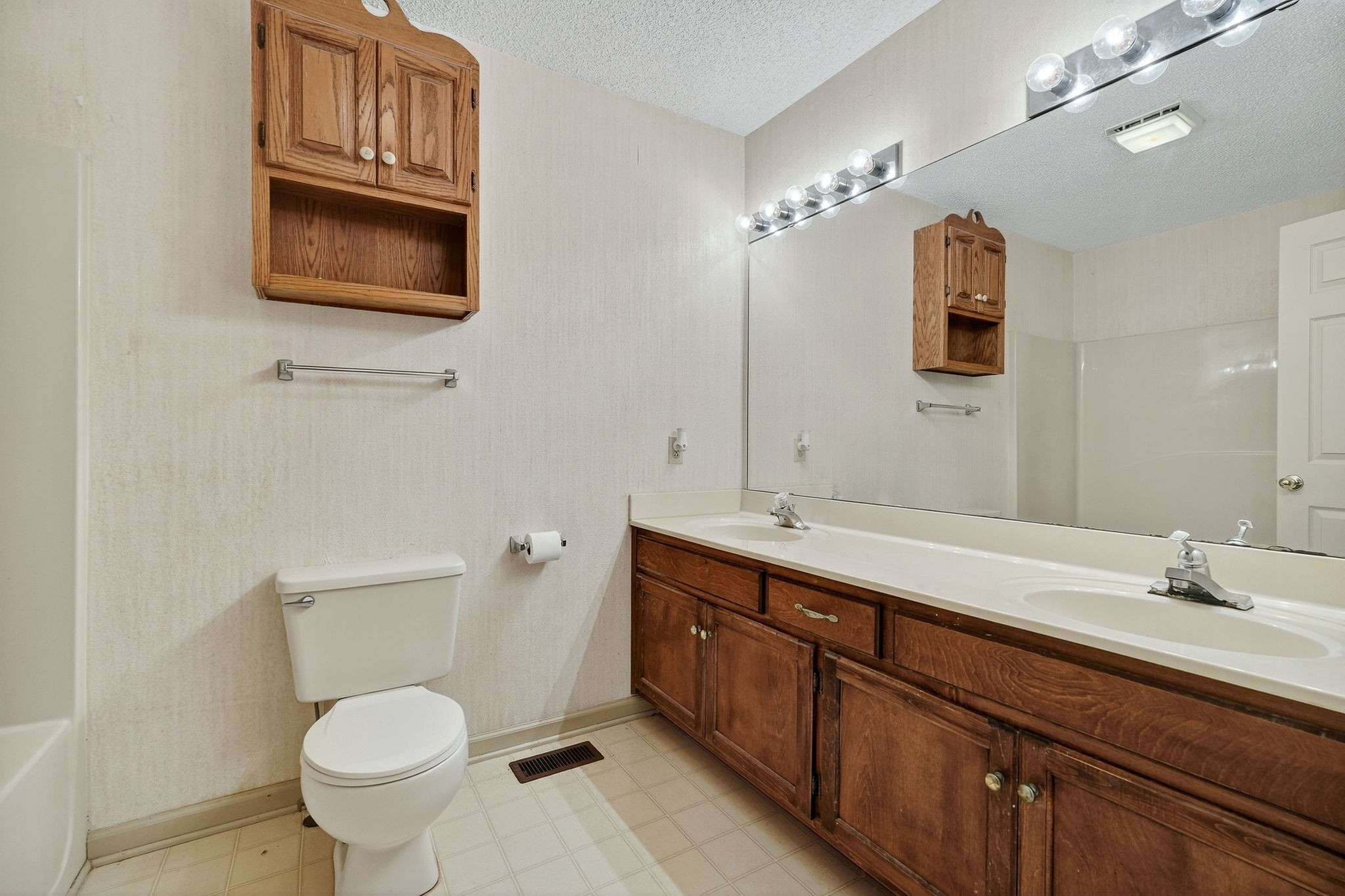 4143 Viola Road McMinnville, TN 37110 - Photo 15 of 27 a bathroom with a toilet a sink and mirror