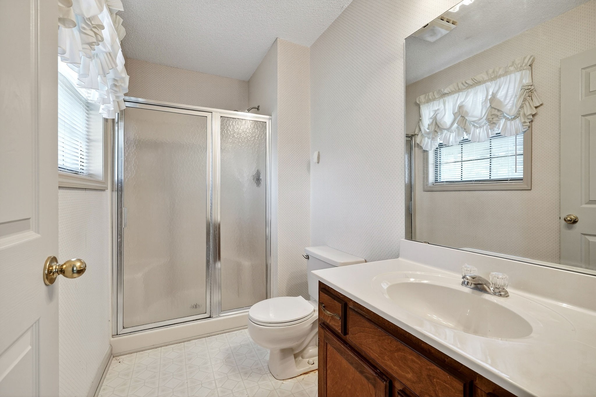 4143 Viola Road McMinnville, TN 37110 - Photo 17 of 27 a bathroom with a granite countertop sink toilet and shower