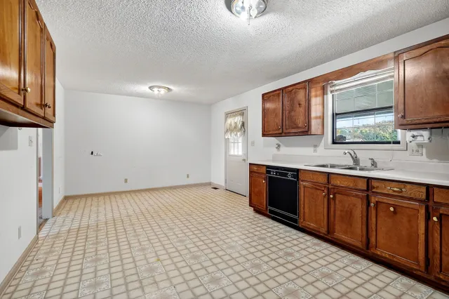 a large bathroom with a double vanity sink a mirror and a shower