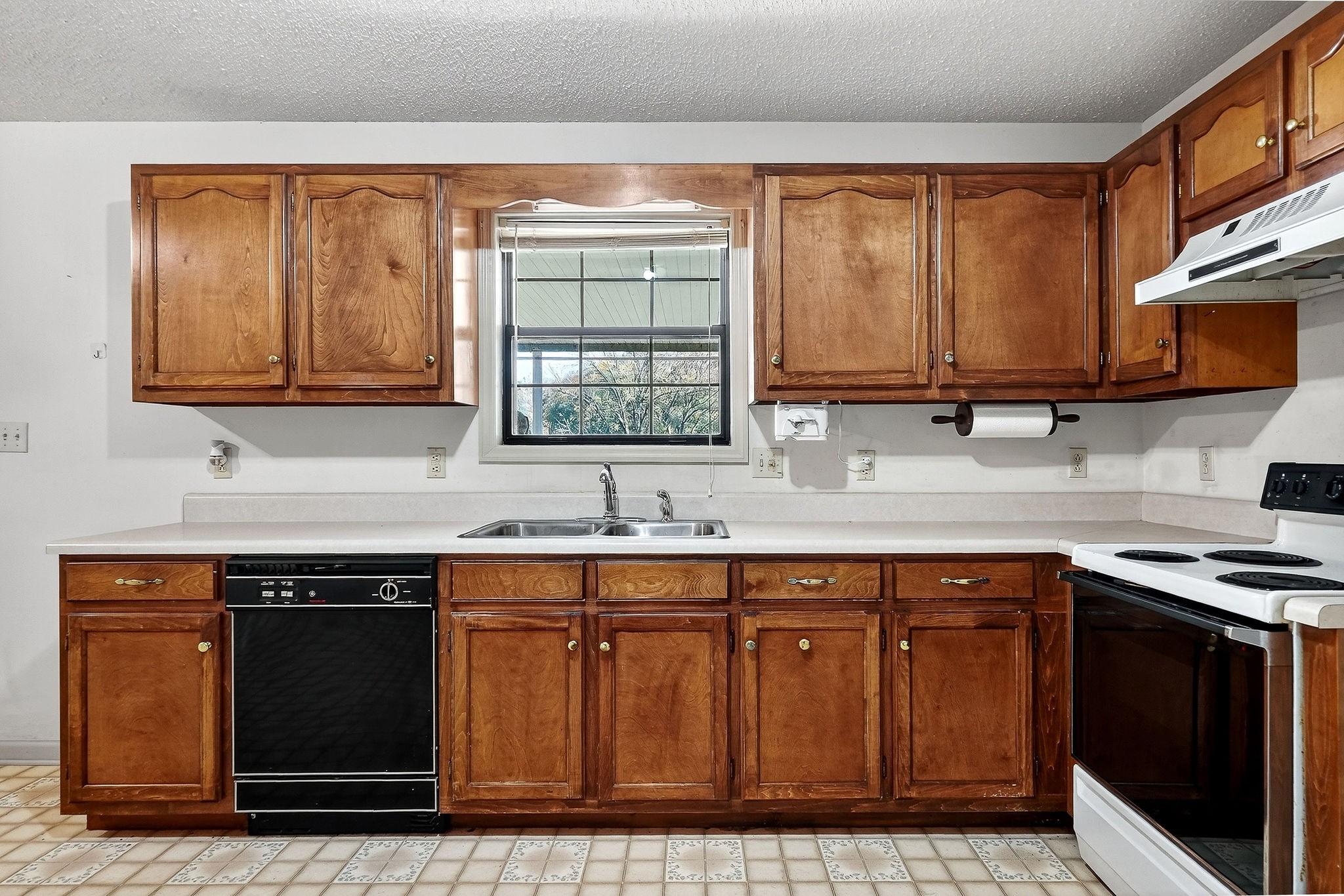 4143 Viola Road McMinnville, TN 37110 - Photo 10 of 27 a kitchen with stainless steel appliances granite countertop a stove a sink and a microwave