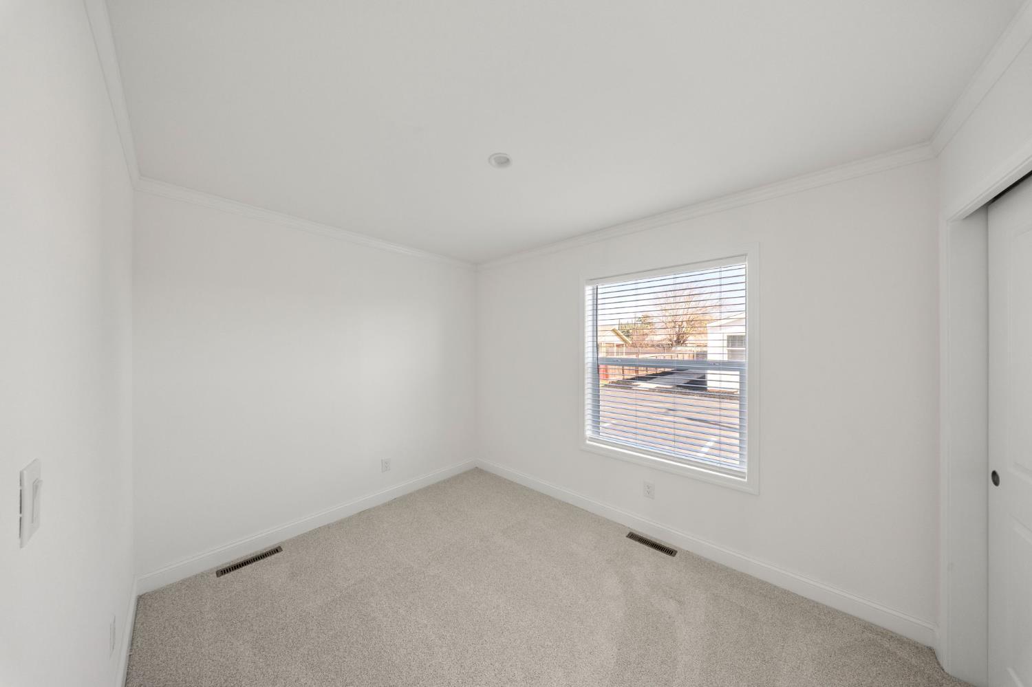 2030 East Grayson Road, Unit 44 Ceres, CA 95307 - Photo 14 of 20 an empty room with windows