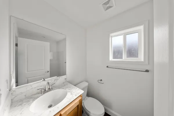 a bathroom with a sink and a toilet