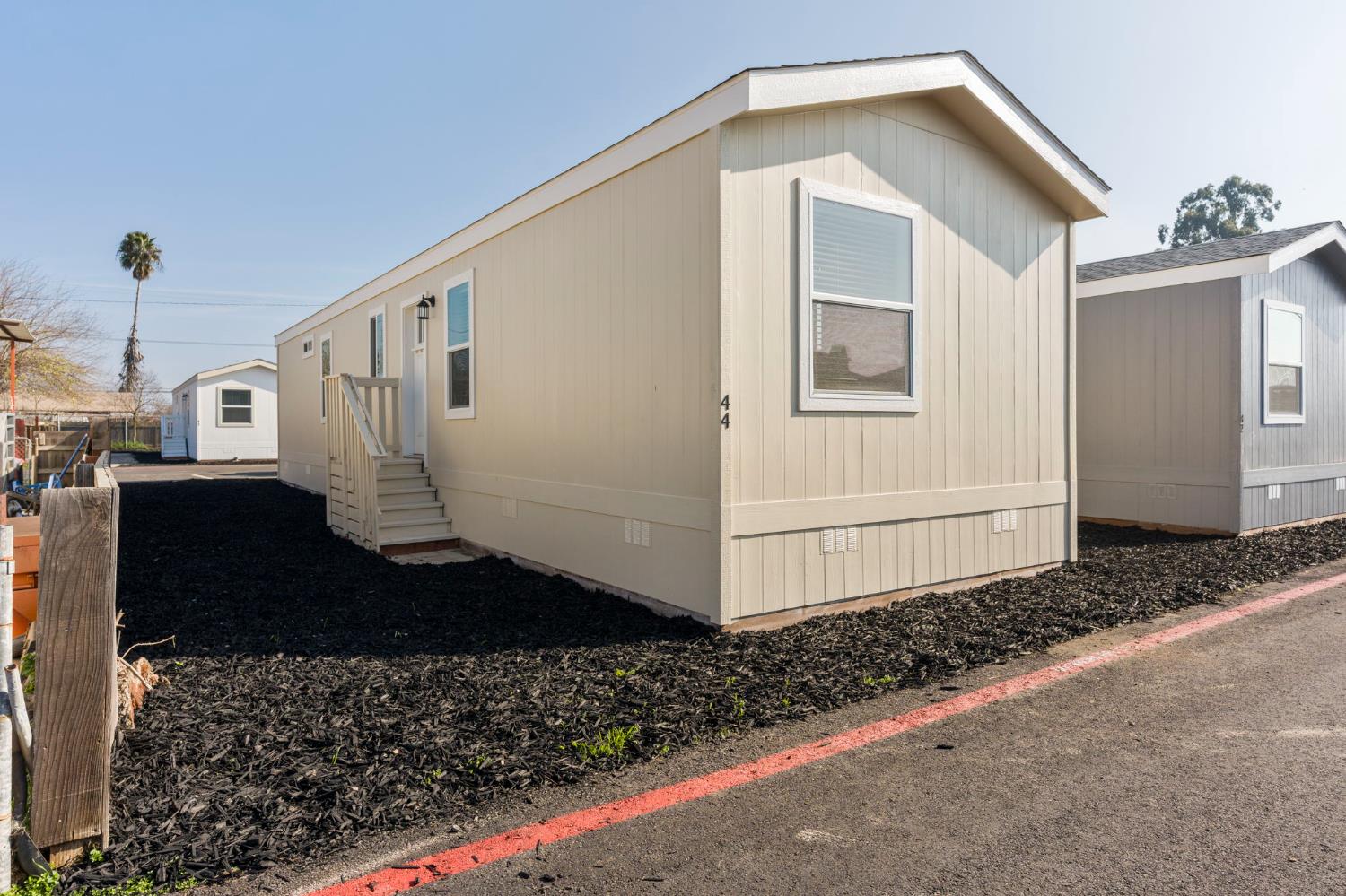 2030 East Grayson Road, Unit 44 Ceres, CA 95307 - Photo 2 of 20 a front view of a house with a yard