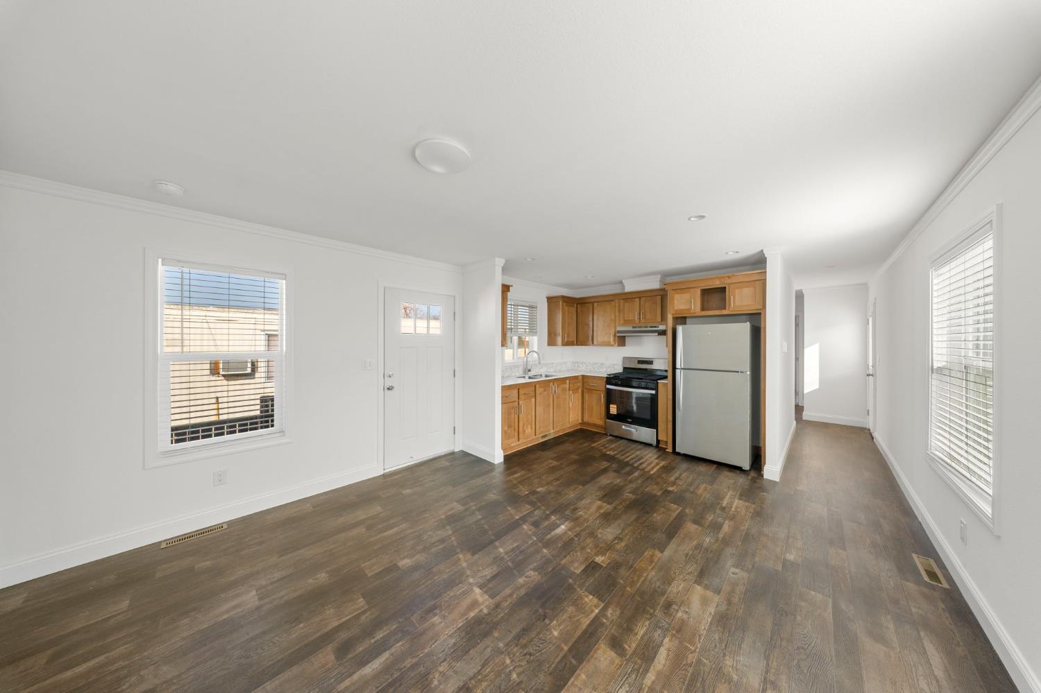 2030 East Grayson Road, Unit 44 Ceres, CA 95307 - Photo 8 of 20 a view of a kitchen with wooden floor and a window