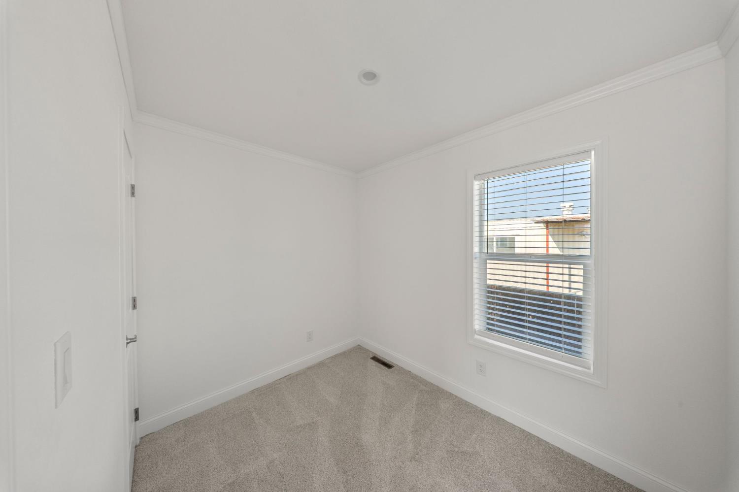 2030 East Grayson Road, Unit 44 Ceres, CA 95307 - Photo 9 of 20 a view of an empty room with a window