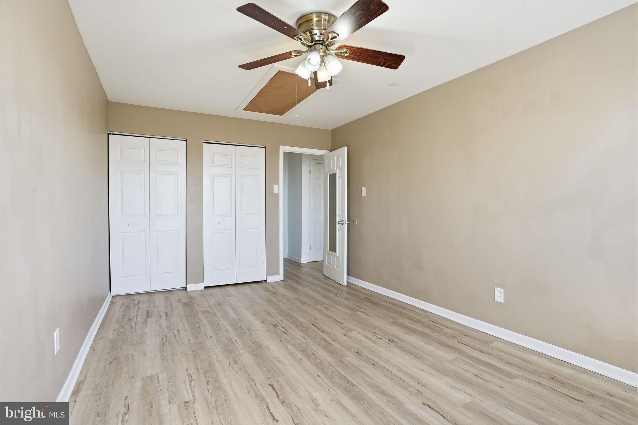 12135 Academy Road, Unit 42 Philadelphia, PA 19154 - Photo 12 of 18 wooden floor in an empty room with a window