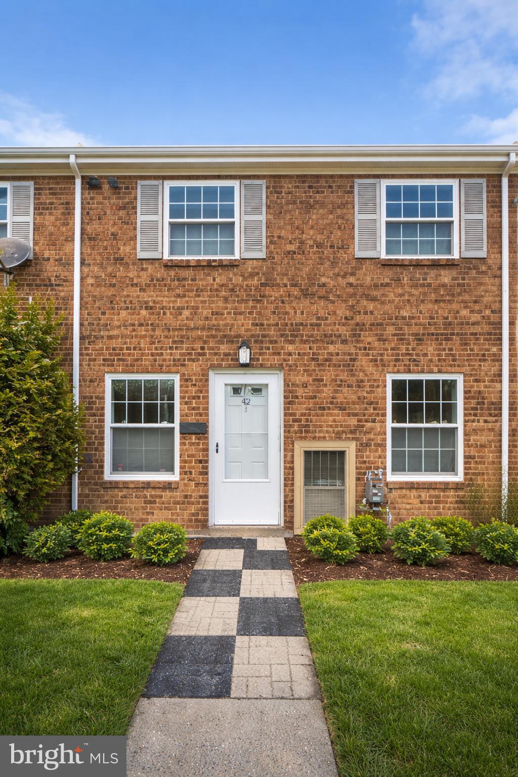 12135 Academy Road, Unit 42 Philadelphia, PA 19154 - Photo 17 of 18 front view of a house and a yard