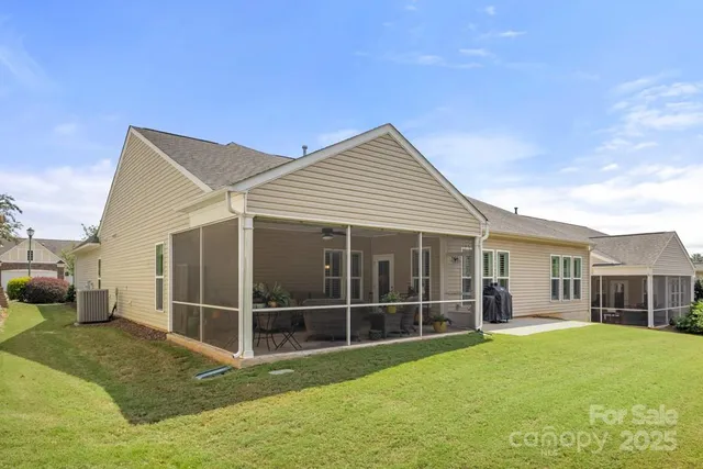 a view of a house with backyard porch and garden