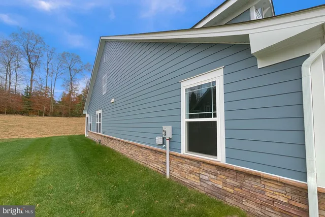 a view of front door and yard