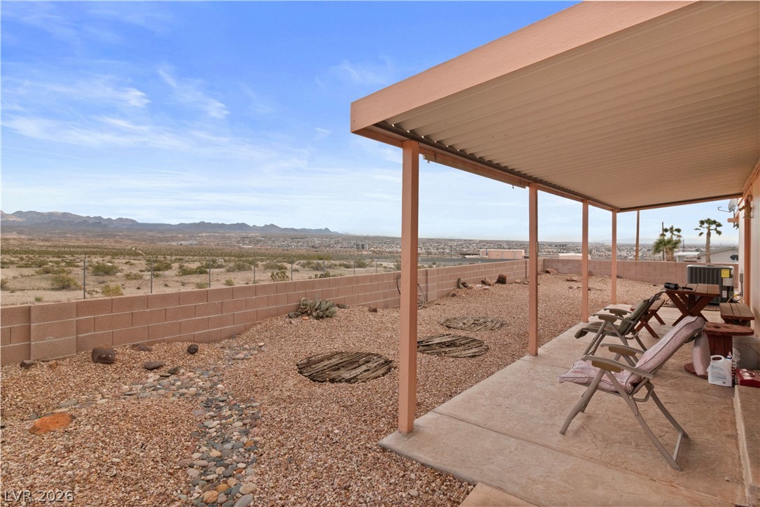 1609 Cajon Court Laughlin, NV 89029 - Photo 35 of 69 Fenced backyard with a patio area and a mountain view