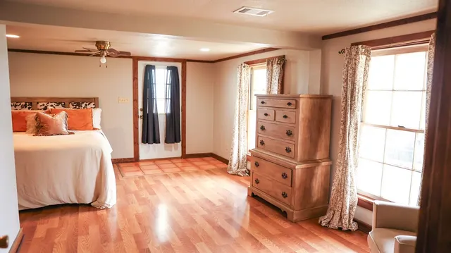 a bedroom with a bed and a window