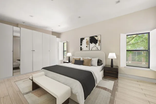 a table and chairs with the view of lake