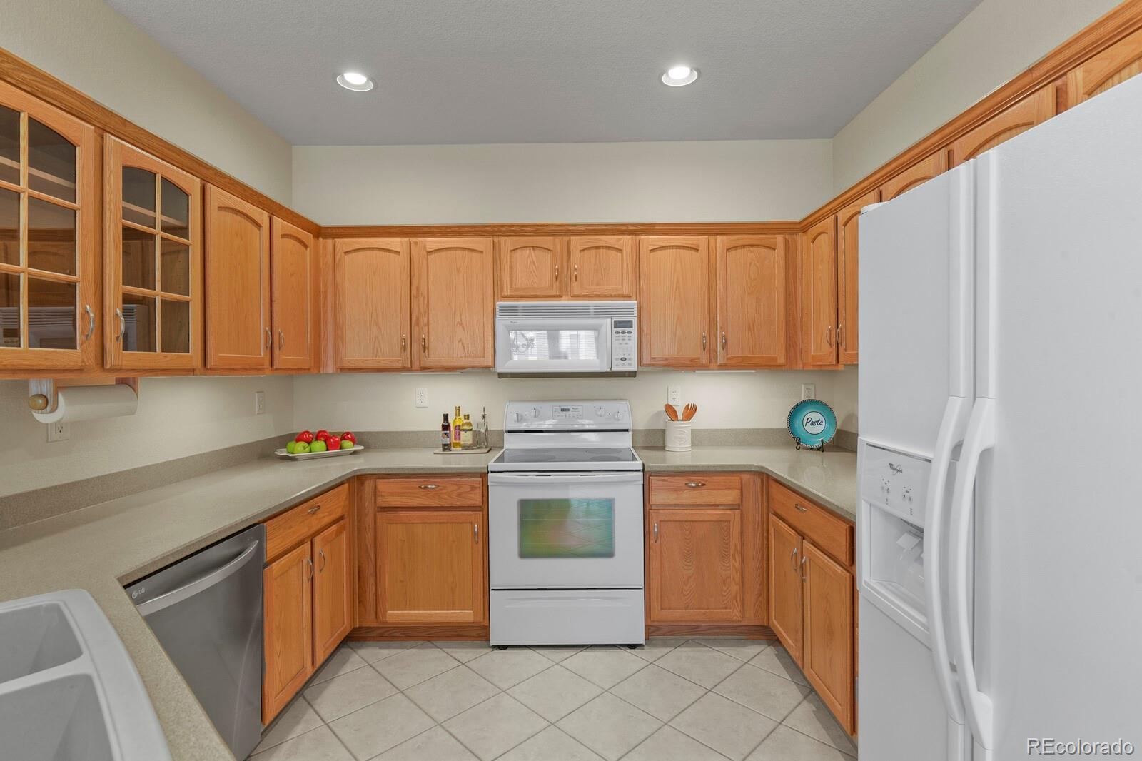152 Whitehaven Circle Highlands Ranch, CO 80129 - Photo 15 of 25 a kitchen with a stove top oven sink and cabinets