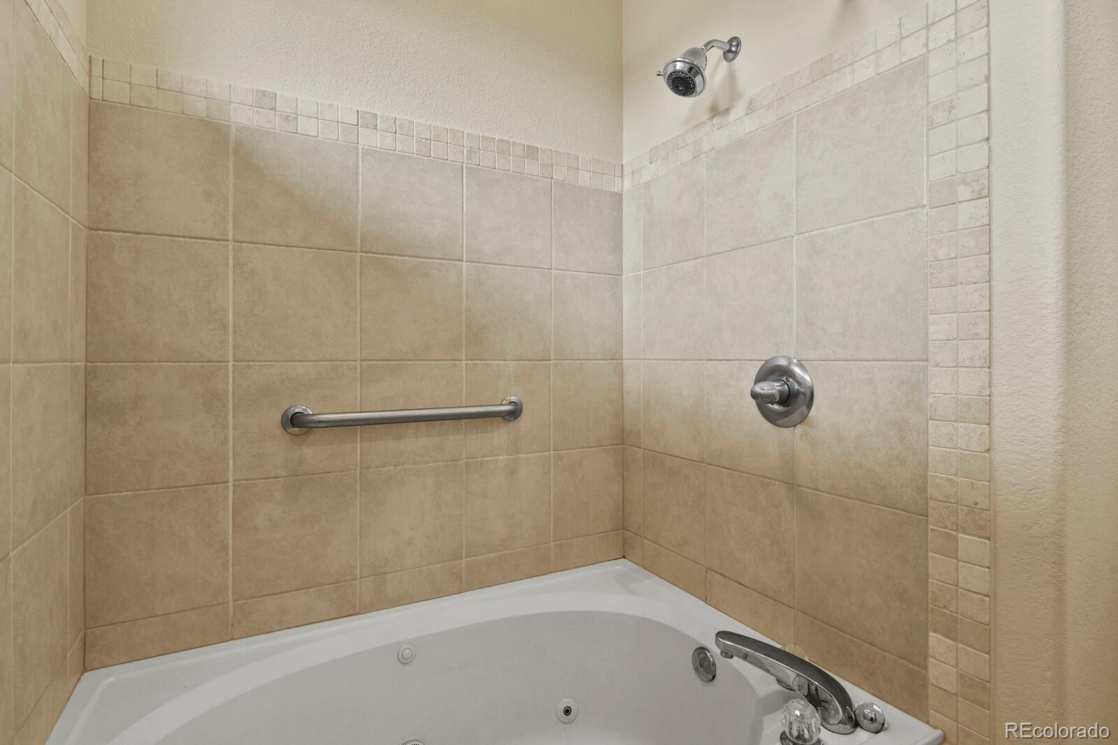 152 Whitehaven Circle Highlands Ranch, CO 80129 - Photo 20 of 25 a bathroom with a bathtub