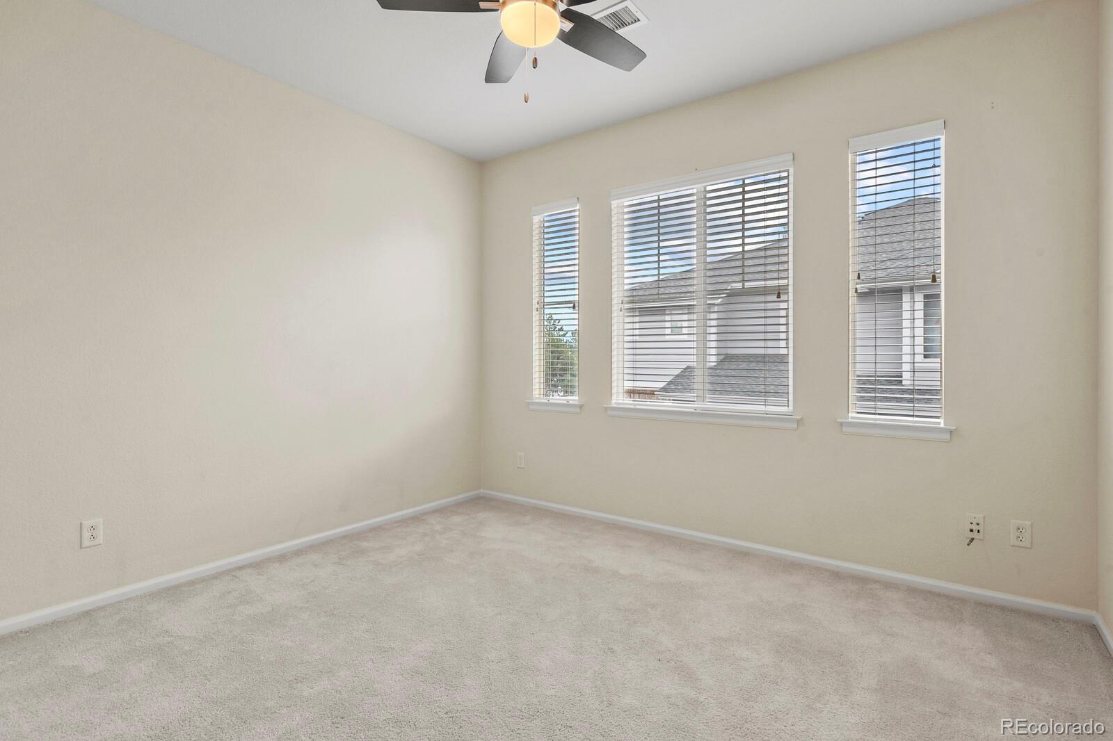 152 Whitehaven Circle Highlands Ranch, CO 80129 - Photo 21 of 25 an empty room with a window