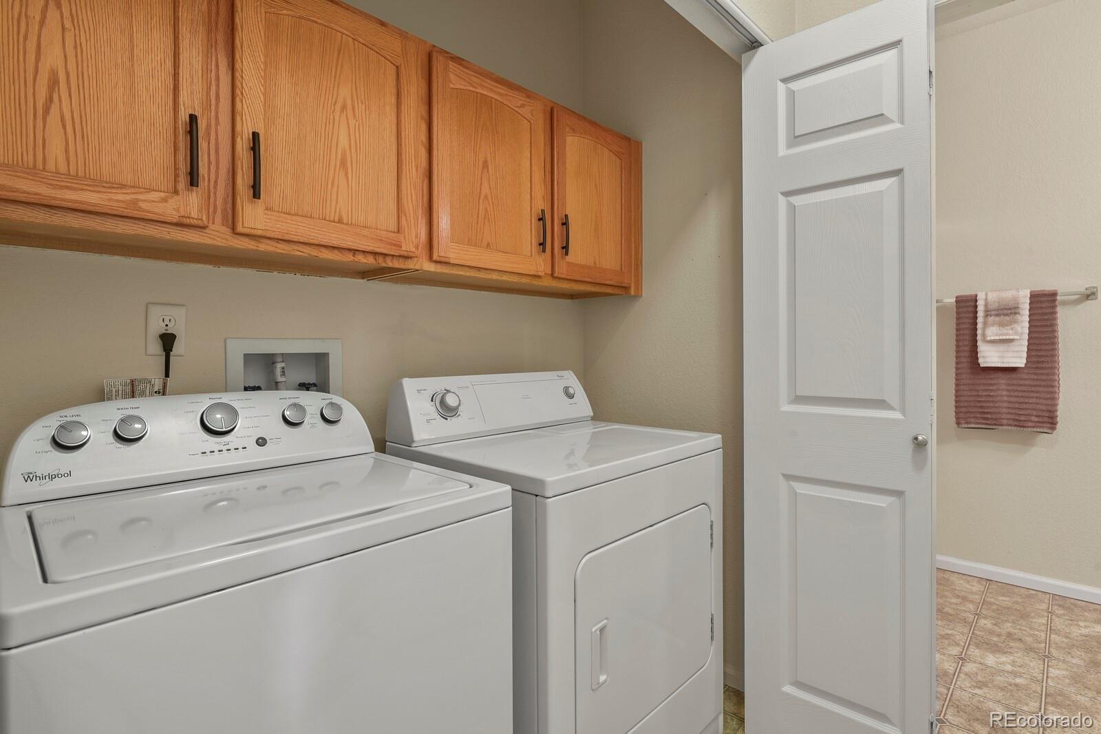152 Whitehaven Circle Highlands Ranch, CO 80129 - Photo 24 of 25 a utility room with dryer and washer