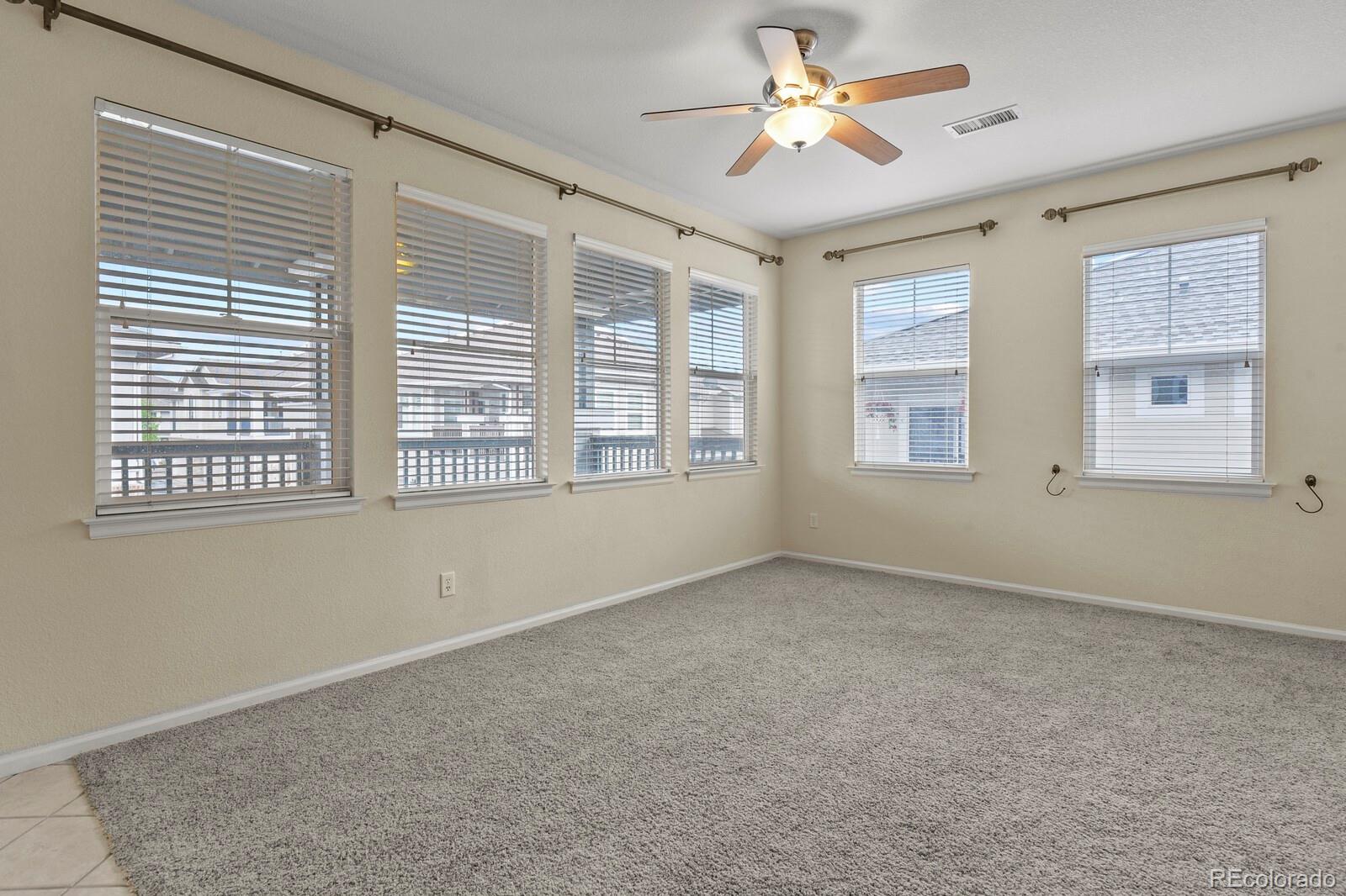 152 Whitehaven Circle Highlands Ranch, CO 80129 - Photo 3 of 25 a view of an empty room with a window