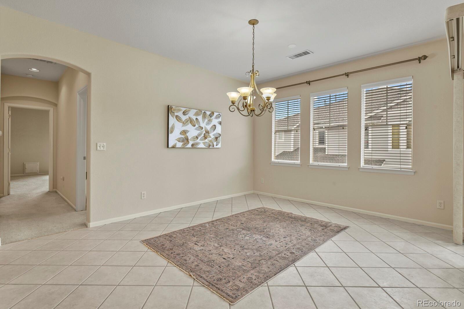 152 Whitehaven Circle Highlands Ranch, CO 80129 - Photo 5 of 25 a view of an empty room with a window