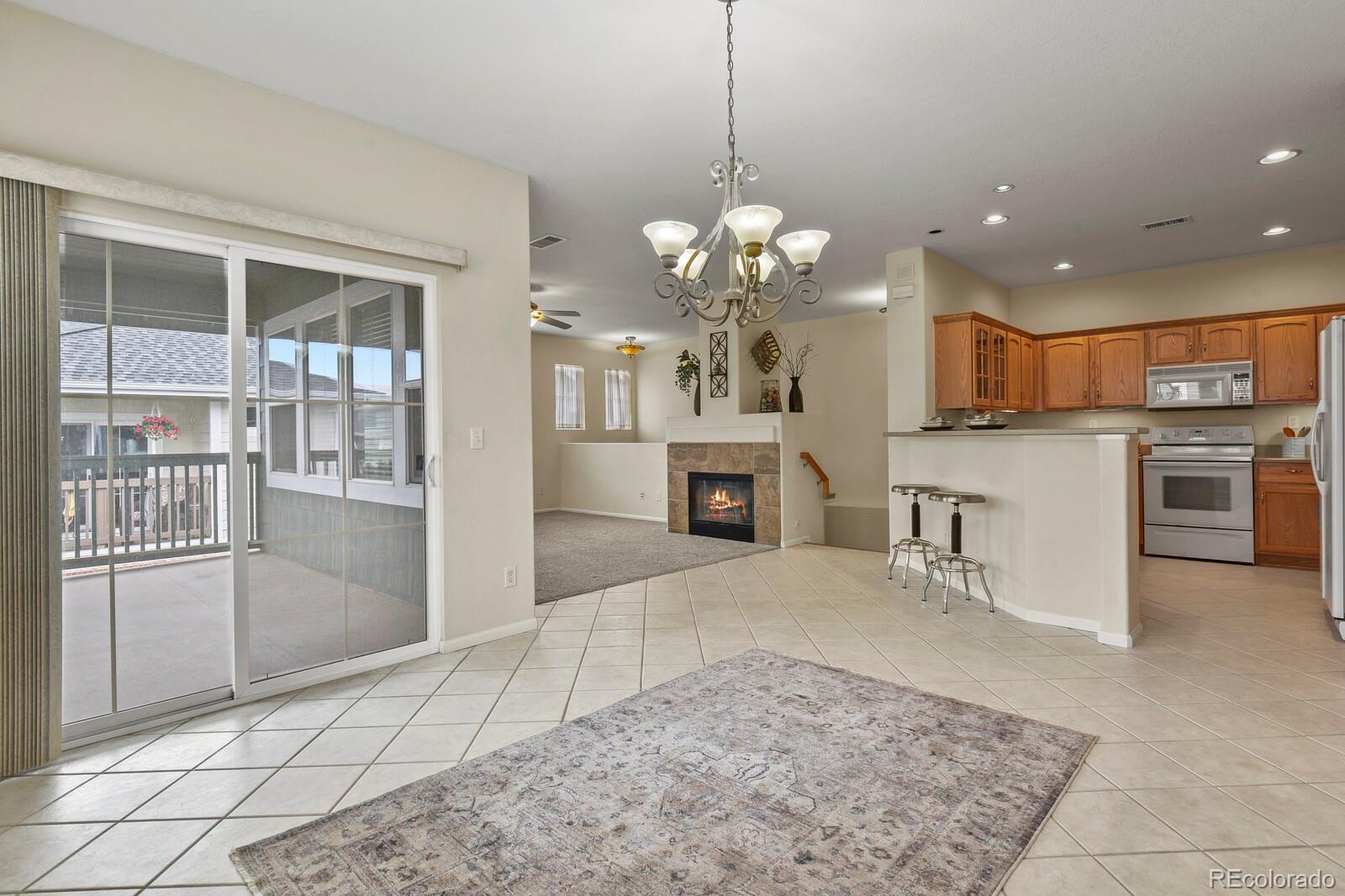 152 Whitehaven Circle Highlands Ranch, CO 80129 - Photo 7 of 25 a view of a kitchen with a sink and microwave