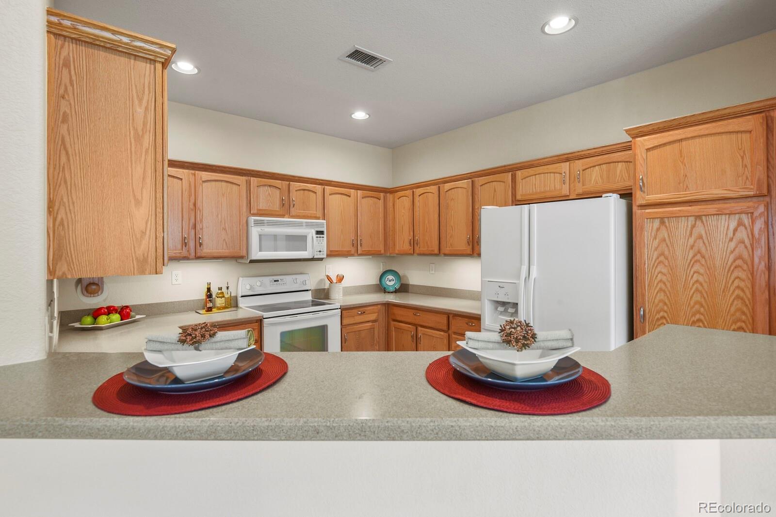 152 Whitehaven Circle Highlands Ranch, CO 80129 - Photo 10 of 25 a kitchen with a sink appliances and cabinets