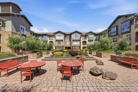 a view of a chairs and table in the patio