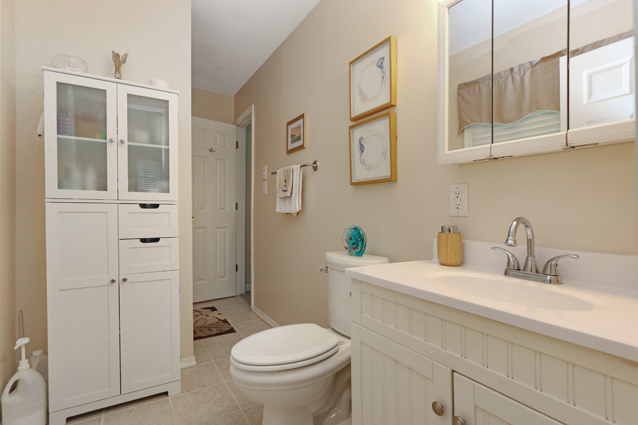 13431 Solitude Trail Machipongo, VA 23405 - Photo 22 of 32 Charming bathroom with serene decor.