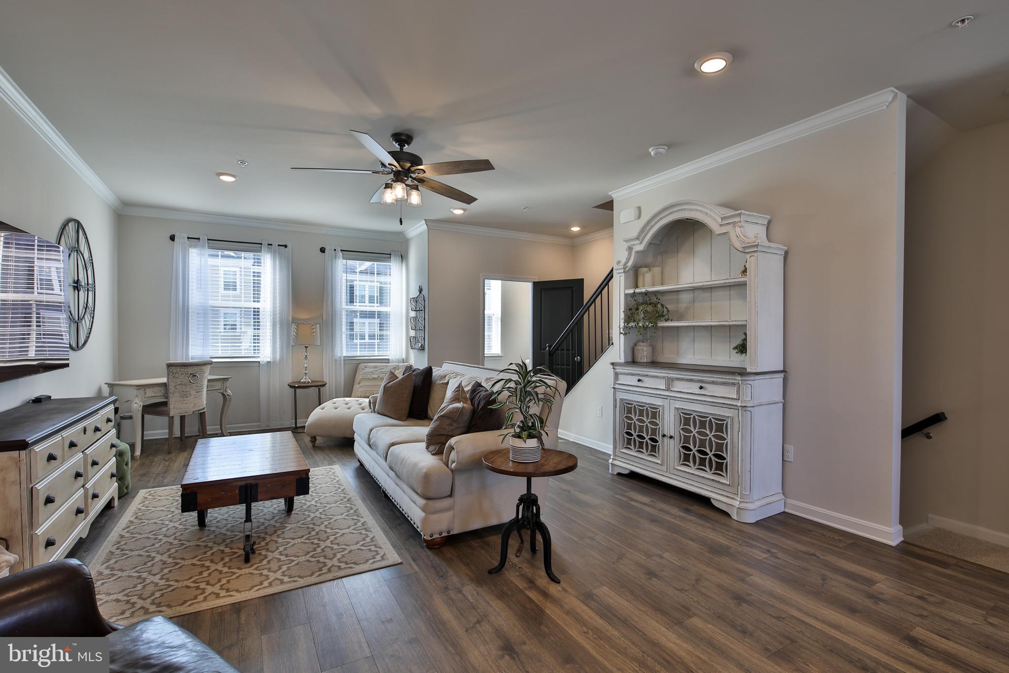 5059 Silver Oak Drive Rosedale, MD 21237 - Photo 12 of 43 a living room with furniture and a wooden floor