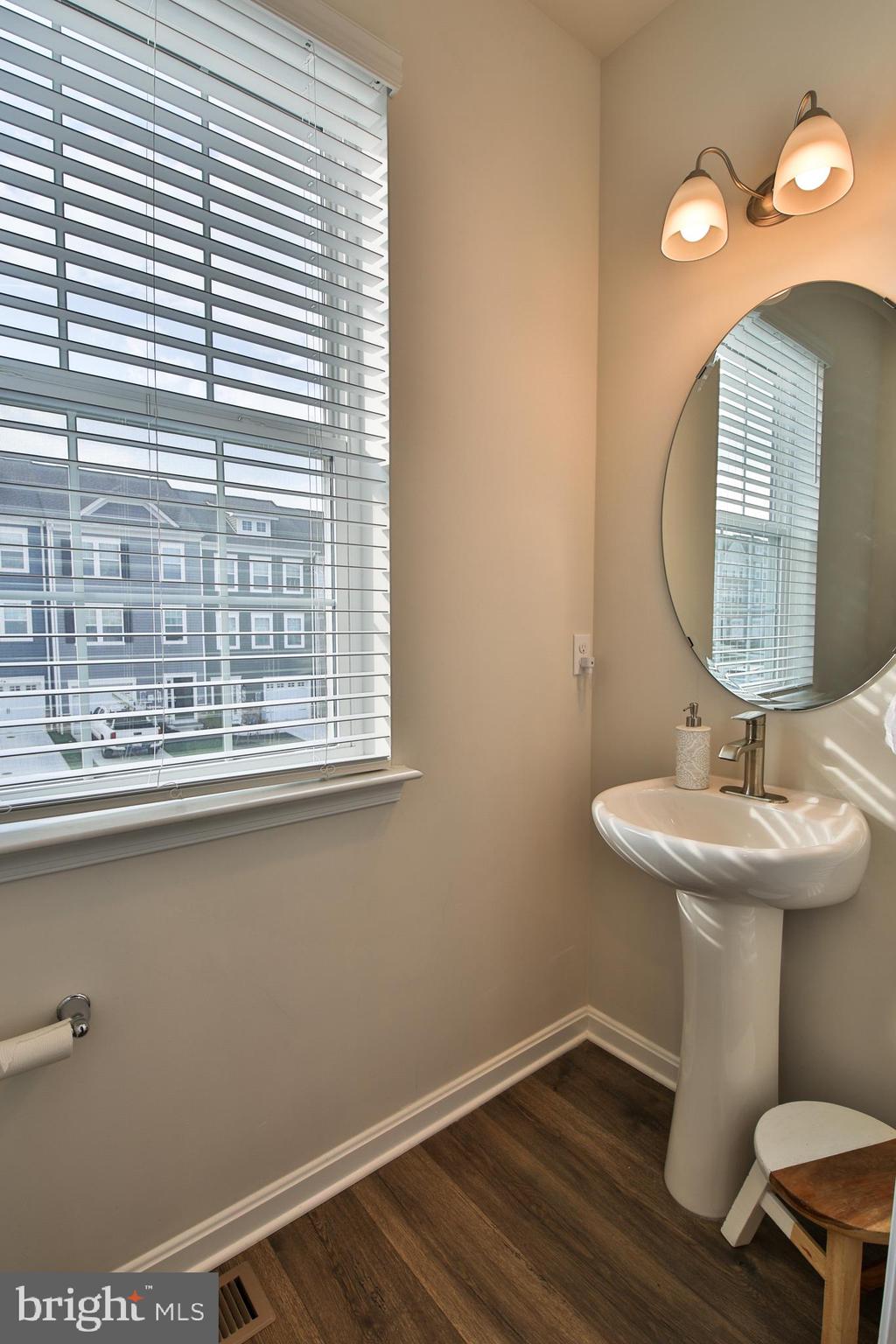 5059 Silver Oak Drive Rosedale, MD 21237 - Photo 13 of 43 a bathroom with a sink and a mirror