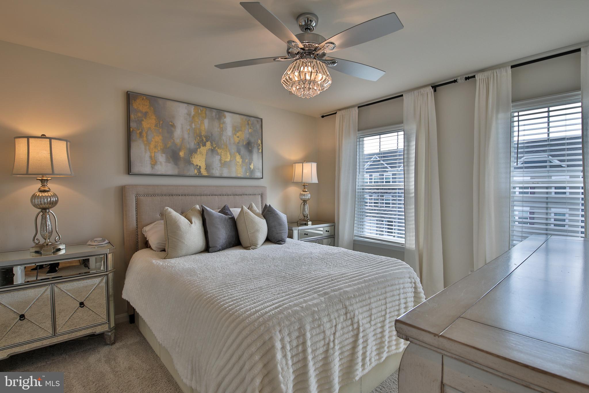5059 Silver Oak Drive Rosedale, MD 21237 - Photo 15 of 43 a bedroom with a large bed and a window