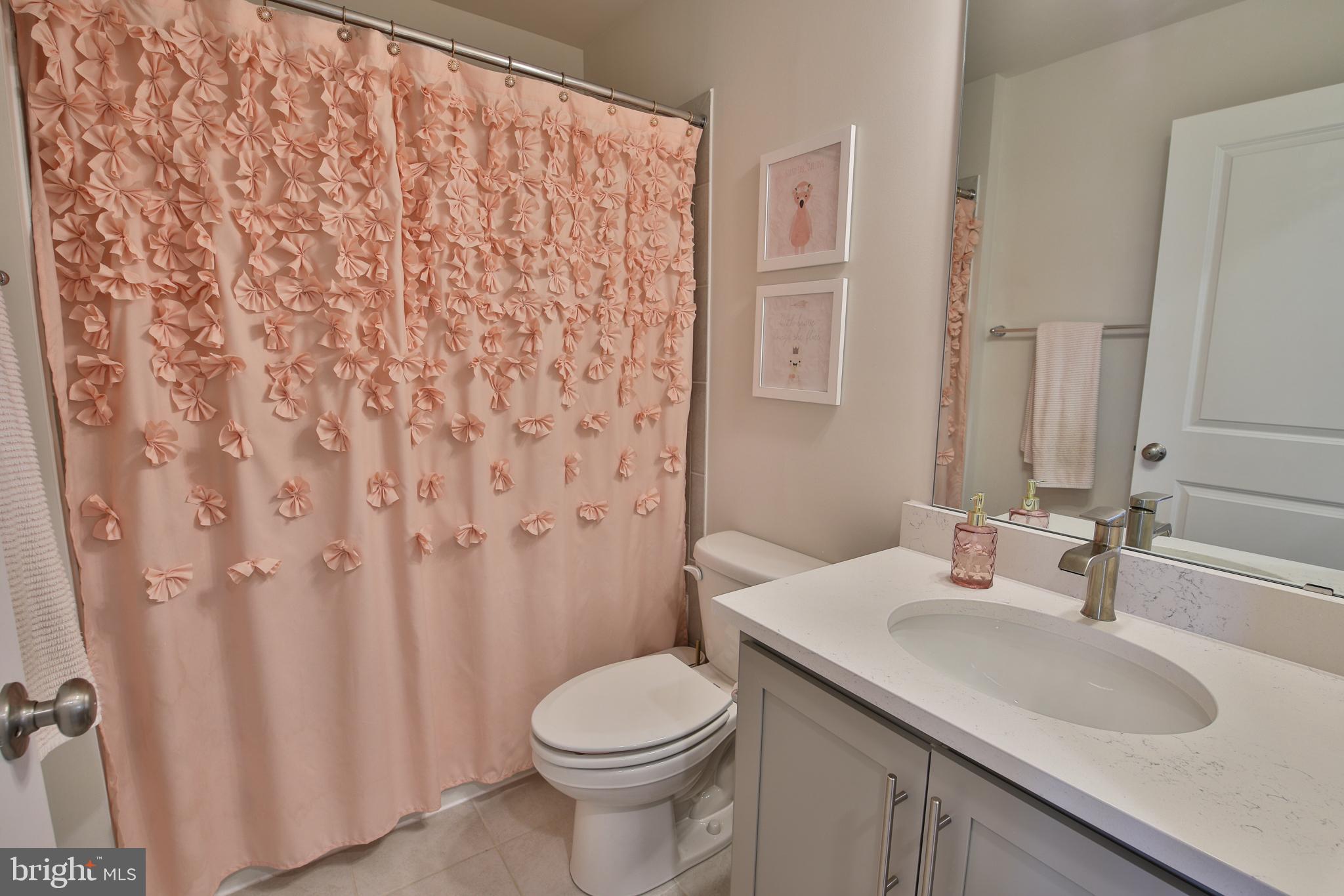5059 Silver Oak Drive Rosedale, MD 21237 - Photo 23 of 43 a bathroom with a granite countertop sink toilet and shower