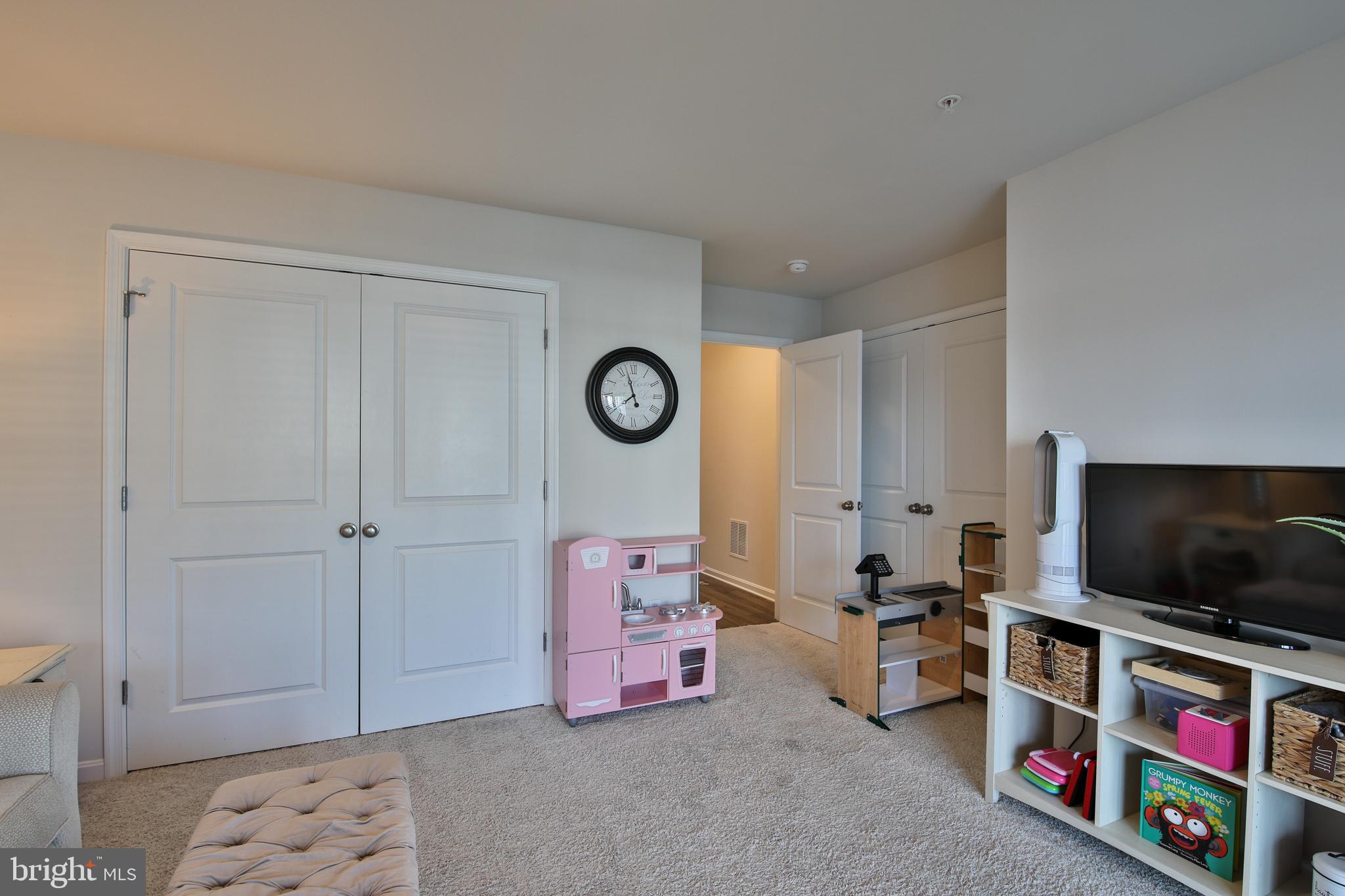 5059 Silver Oak Drive Rosedale, MD 21237 - Photo 29 of 43 a living room with furniture and a flat screen tv