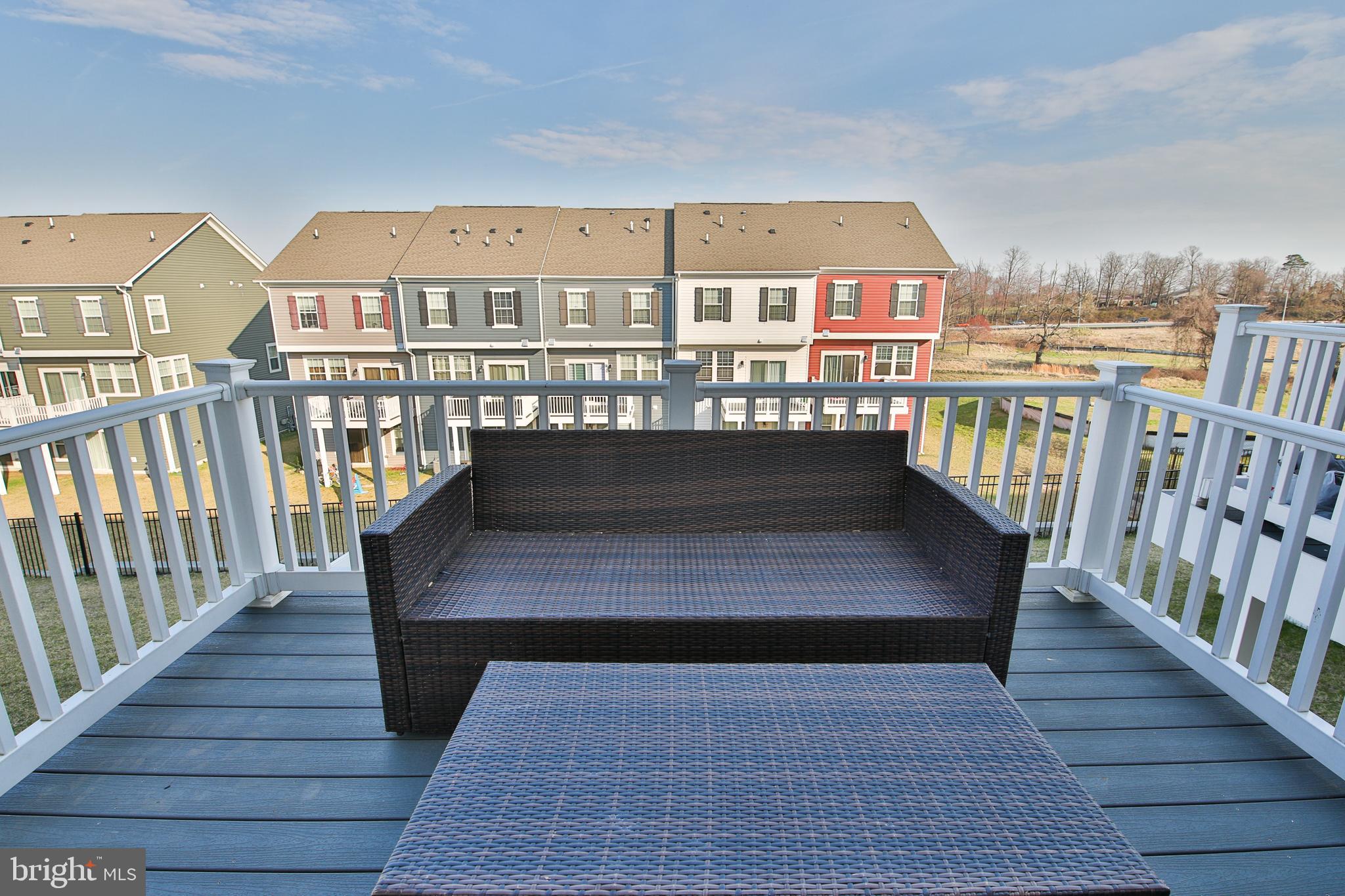 5059 Silver Oak Drive Rosedale, MD 21237 - Photo 33 of 43 a view of a balcony with wooden floor