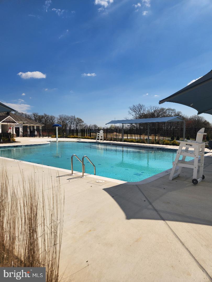 5059 Silver Oak Drive Rosedale, MD 21237 - Photo 39 of 43 a view of a swimming pool and an outdoor space