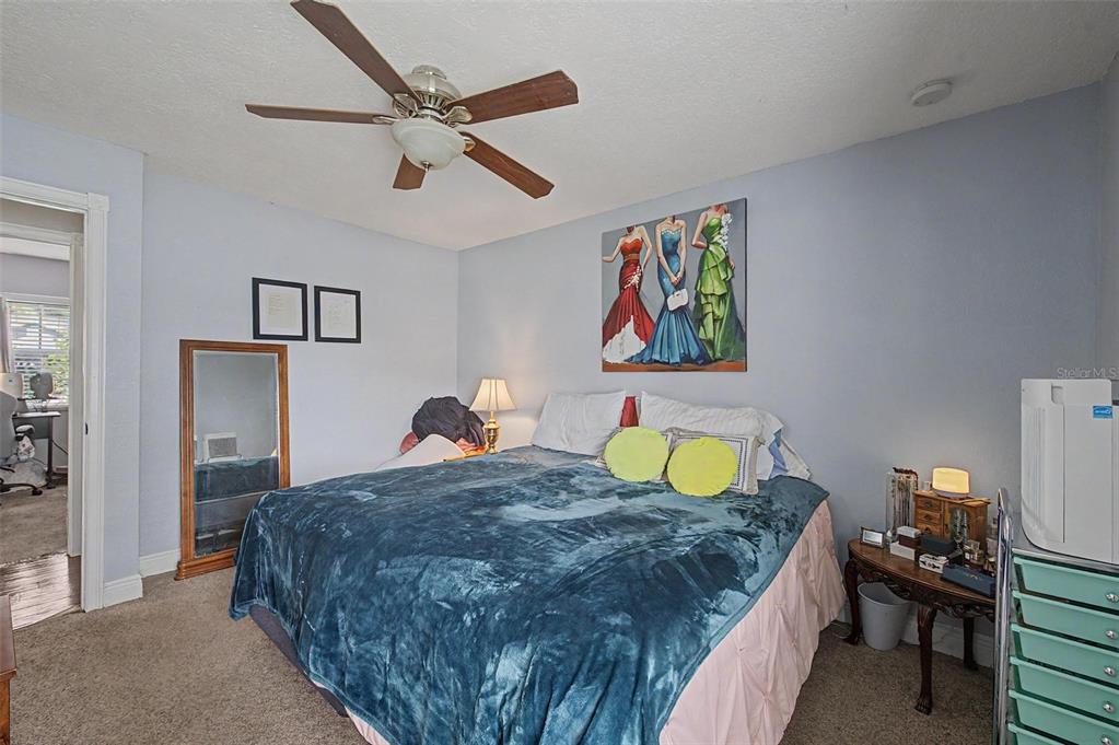 1632 Pintail Court Lutz, FL 33549 - Photo 18 of 34 a bedroom with a bed and a table