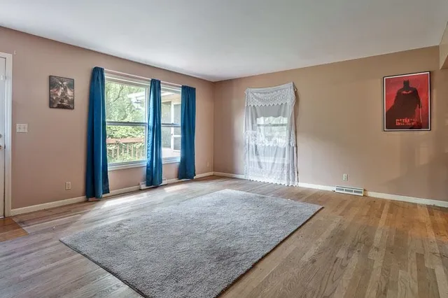 a view of a livingroom with furniture and windows