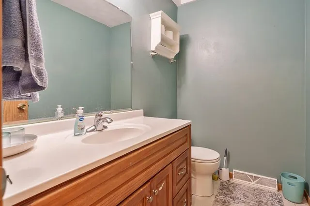 a view of a dining room with furniture and window