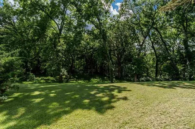 an aerial view of a house with outdoor space