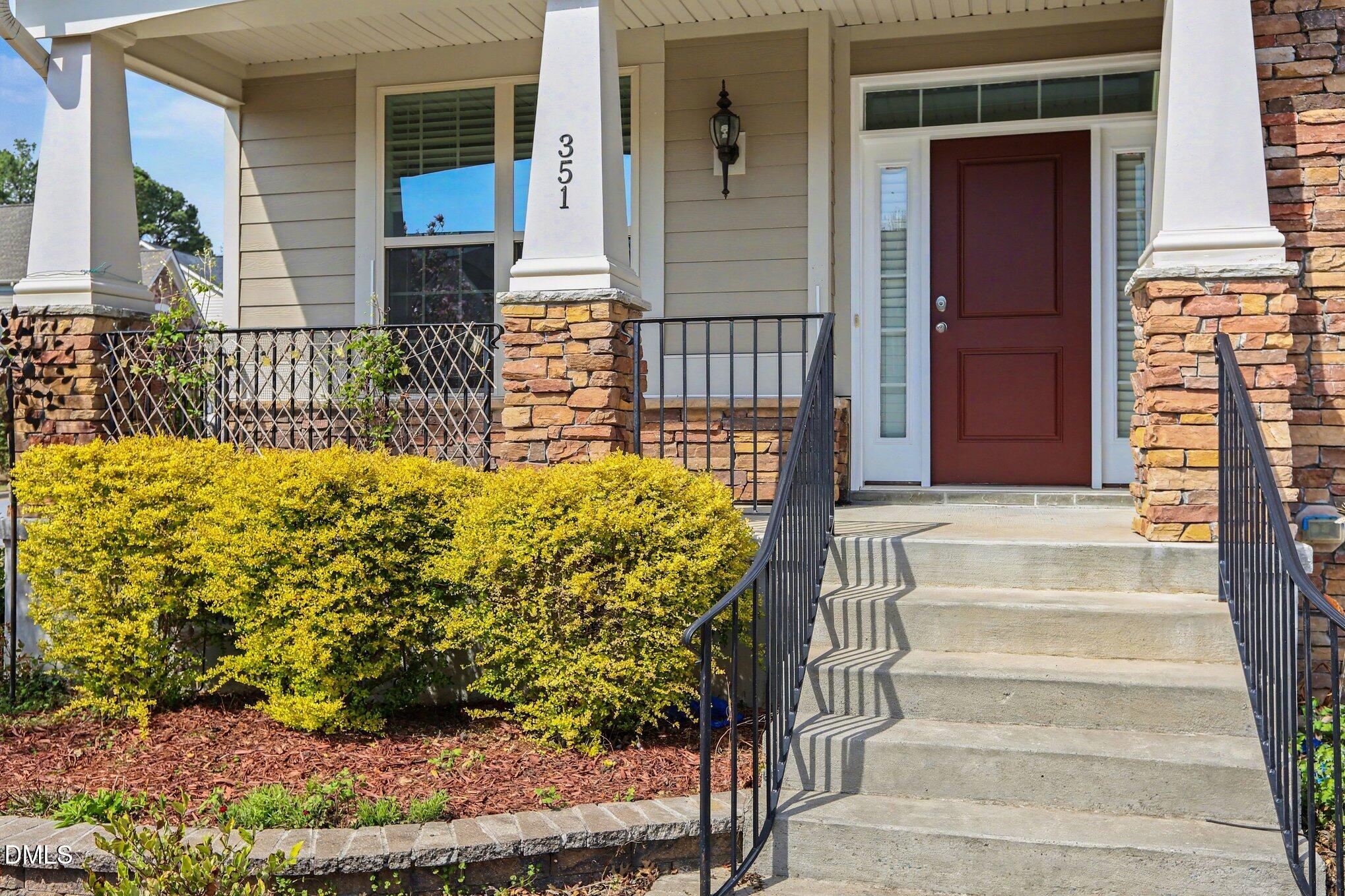351 Gartrell Way Cary, NC 27519 - Photo 5 of 51 a view of front door of house with potted plants
