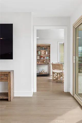 a en suite bathroom with a sink a mirror and a wooden floor