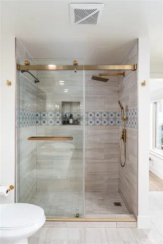 a view of a patio with dining table and chairs under an umbrella