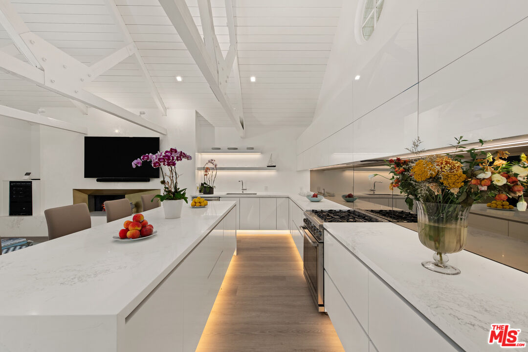 5949 Ramirez Canyon Road Malibu, CA 90265 - Photo 16 of 26 a kitchen with a sink appliances and cabinets